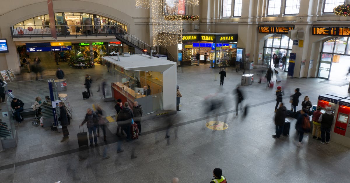 Are there tourist information offices in Cancun, Mexico? - People Walking Inside Train Station