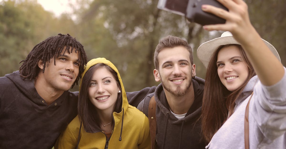 Are women allowed to have dreadlocks in the Maghreb region? - Happy diverse friends taking selfie in park Are women allowed to have dreadlocks in the Maghreb region? - Happy diverse friends taking selfie in park