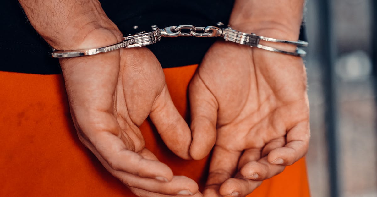 Arrested in 1994 for gang affiliation and overstayed as a minor [closed] - Close-Up Shot of a Person with Handcuffs