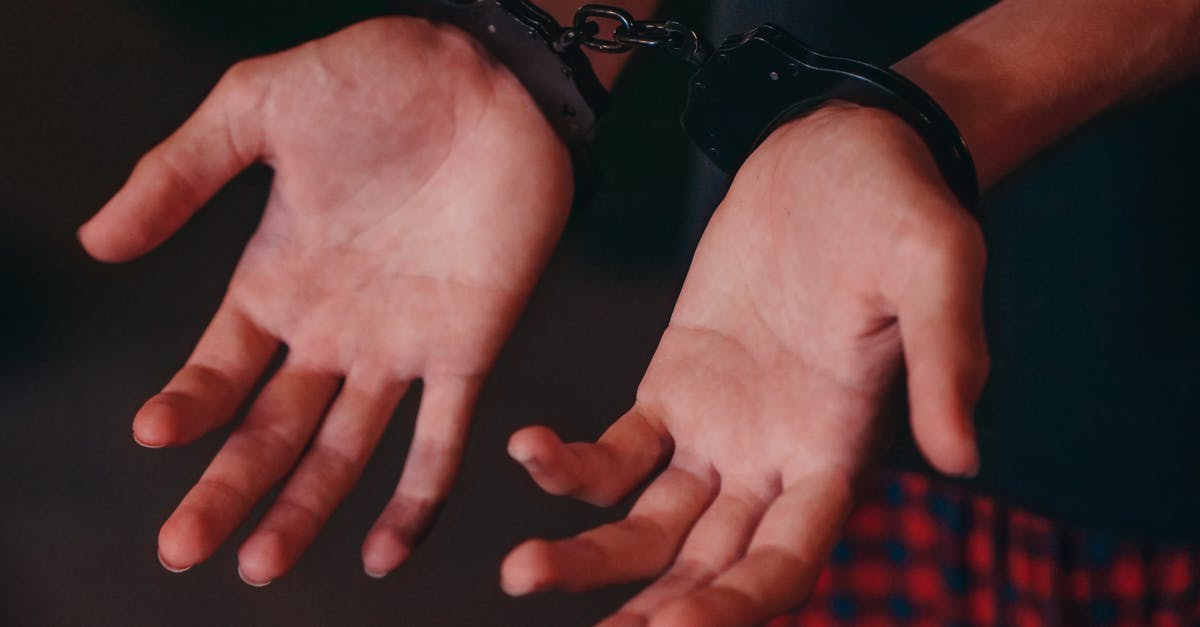 Arrested in 1994 for gang affiliation and overstayed as a minor [closed] - A Person in Handcuffs 