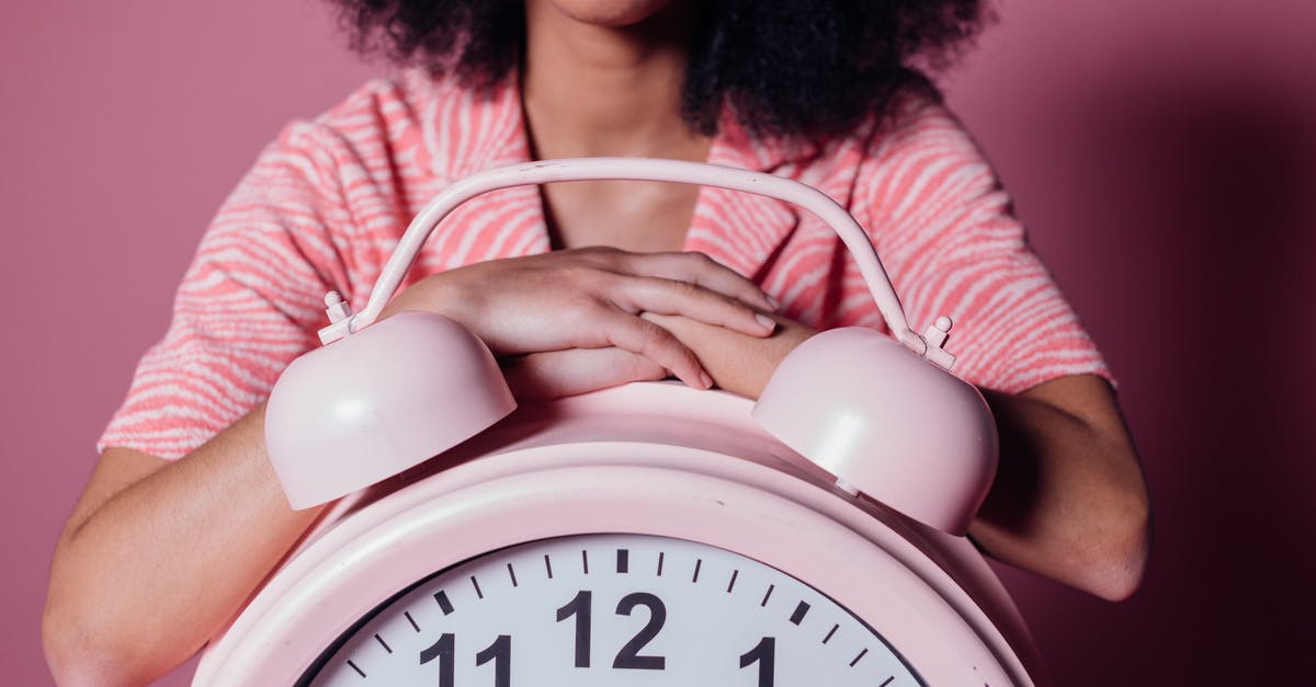 Arriving from Florida into JFK and waiting time to international flight over 10 hours. - Woman on Big Pink Alarm Clock Arriving from Florida into JFK and waiting time to international flight over 10 hours. - Woman on Big Pink Alarm Clock