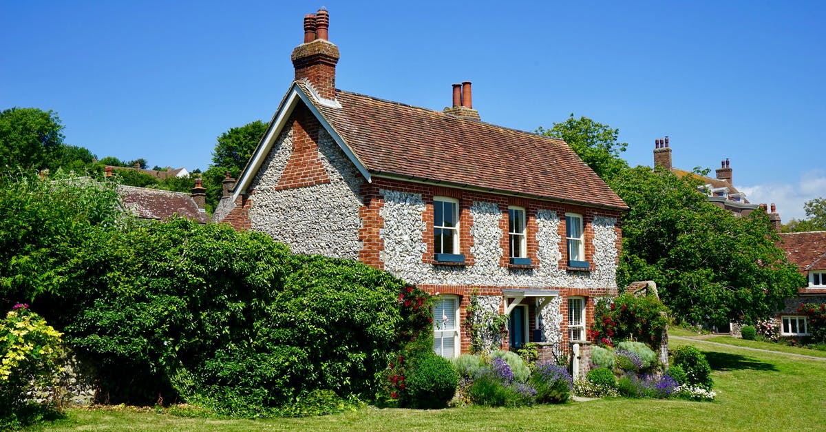 Arriving to home country after visa expires? - White and Brown Concrete 2-storey House Near Tree Arriving to home country after visa expires? - White and Brown Concrete 2-storey House Near Tree