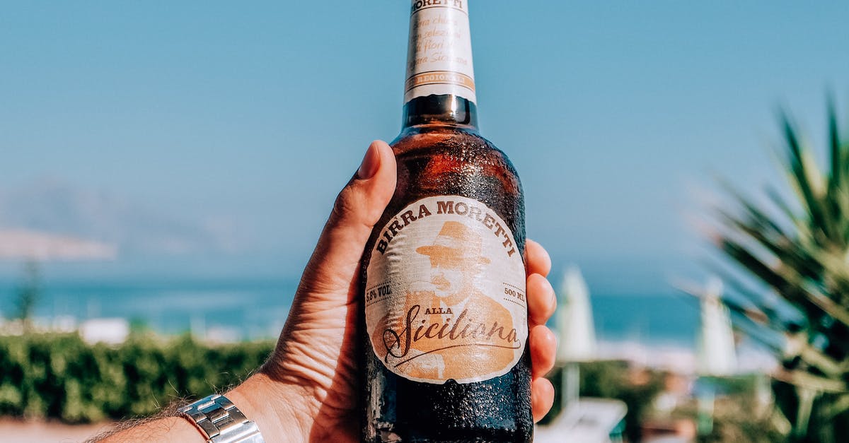 As a tourist in Doha, what are the rules on drinking alcohol in hotels? - Man with alcoholic beer on resort As a tourist in Doha, what are the rules on drinking alcohol in hotels? - Man with alcoholic beer on resort