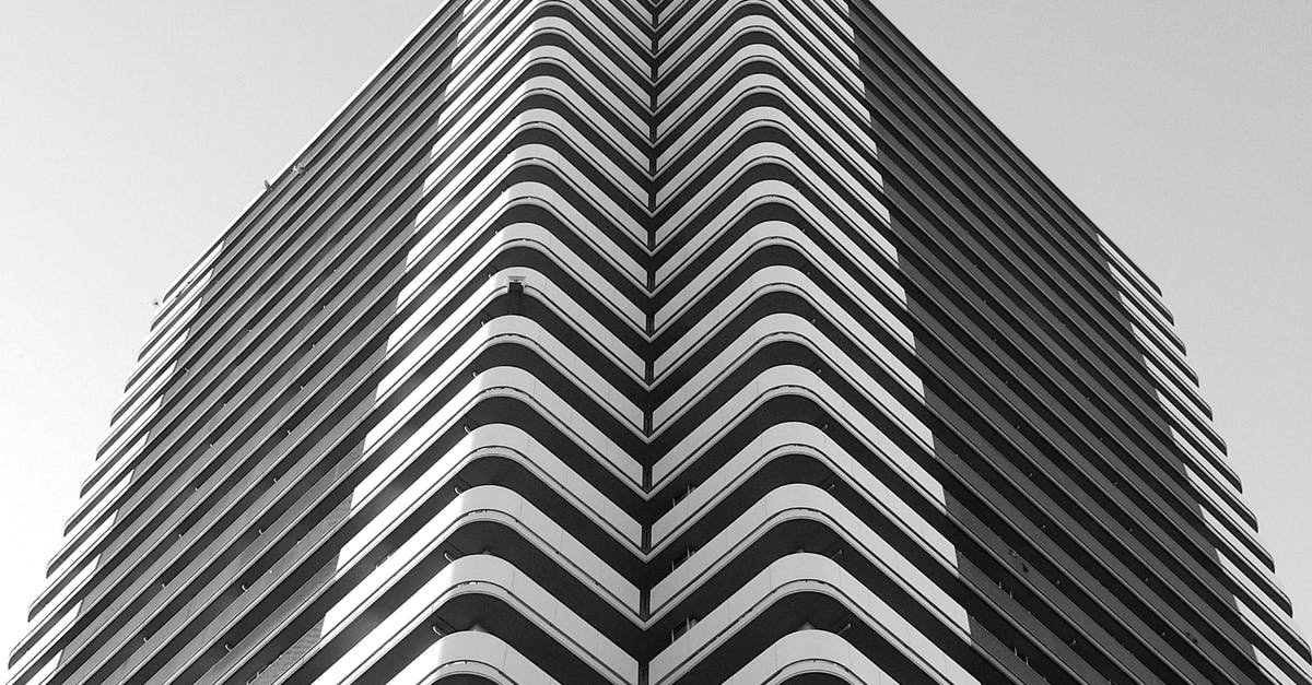 As a web developer what is my new Zealand visa Industry? - Minimalist geometric building with curvy balconies in city As a web developer what is my new Zealand visa Industry? - Minimalist geometric building with curvy balconies in city
