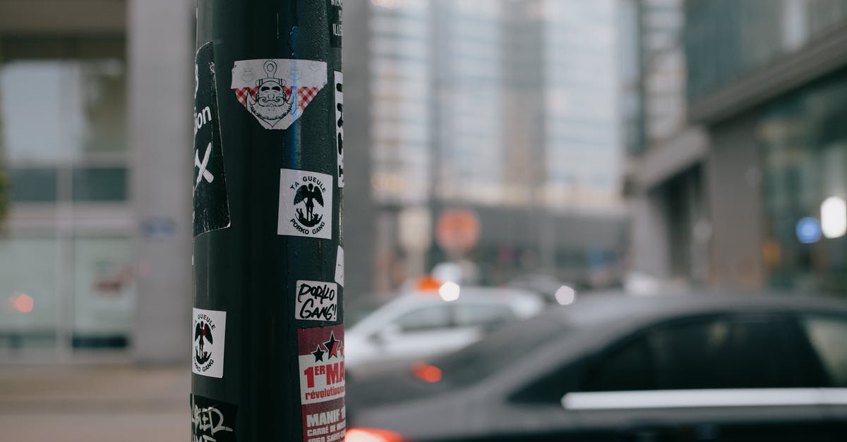 As an Australian driving in South Africa, what differences in traffic or road rules do I need to know? - Stickers attached to pillar on city street As an Australian driving in South Africa, what differences in traffic or road rules do I need to know? - Stickers attached to pillar on city street