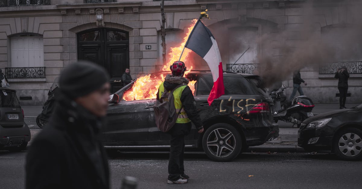 As an EU national, what (if any) ID do I need to carry when crossing between France and Belgium? - Man in Black Jacket Holding Red and Yellow Umbrella As an EU national, what (if any) ID do I need to carry when crossing between France and Belgium? - Man in Black Jacket Holding Red and Yellow Umbrella