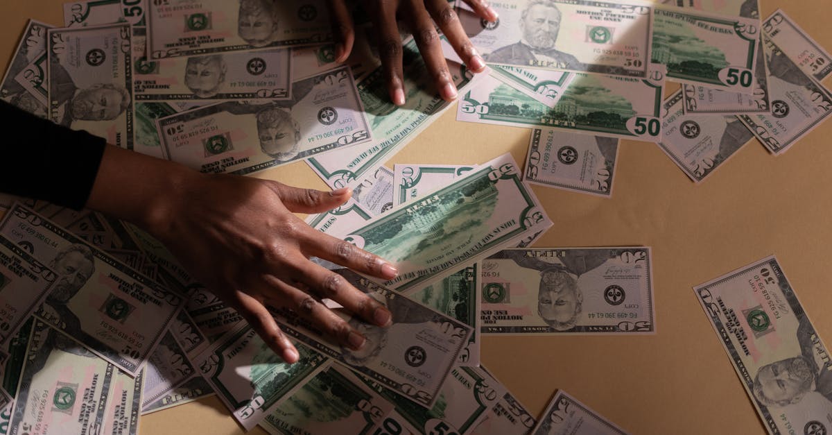 Asked by Ethiopian airlines to pay 3500 USD for being rejected entry to Indonesia - Person Holding Fan of Us Dollar Bill