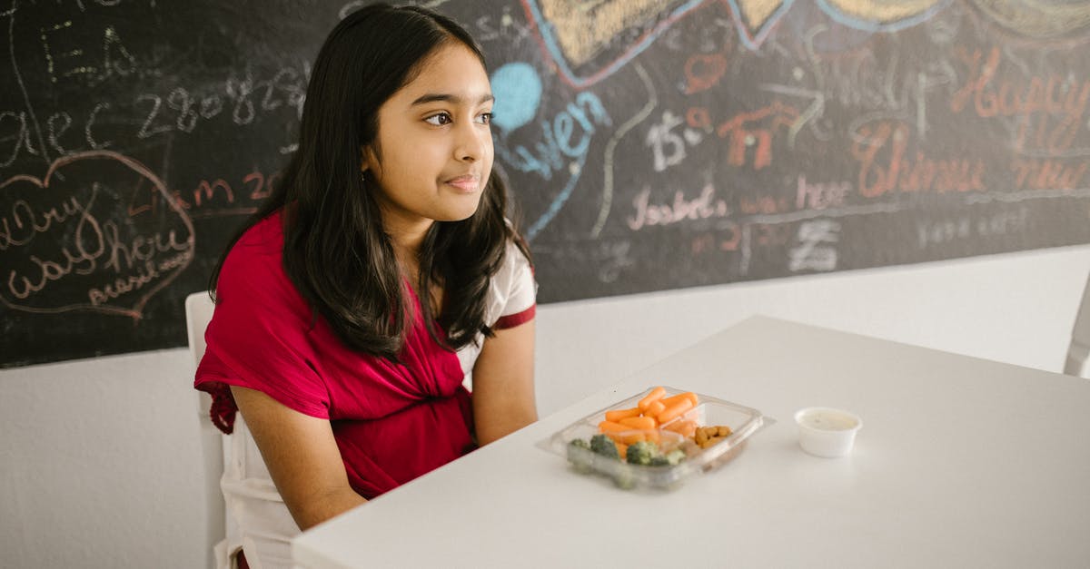 Asking for first class meal while having economy class ticket - Girl Eating Her Snack by Herself