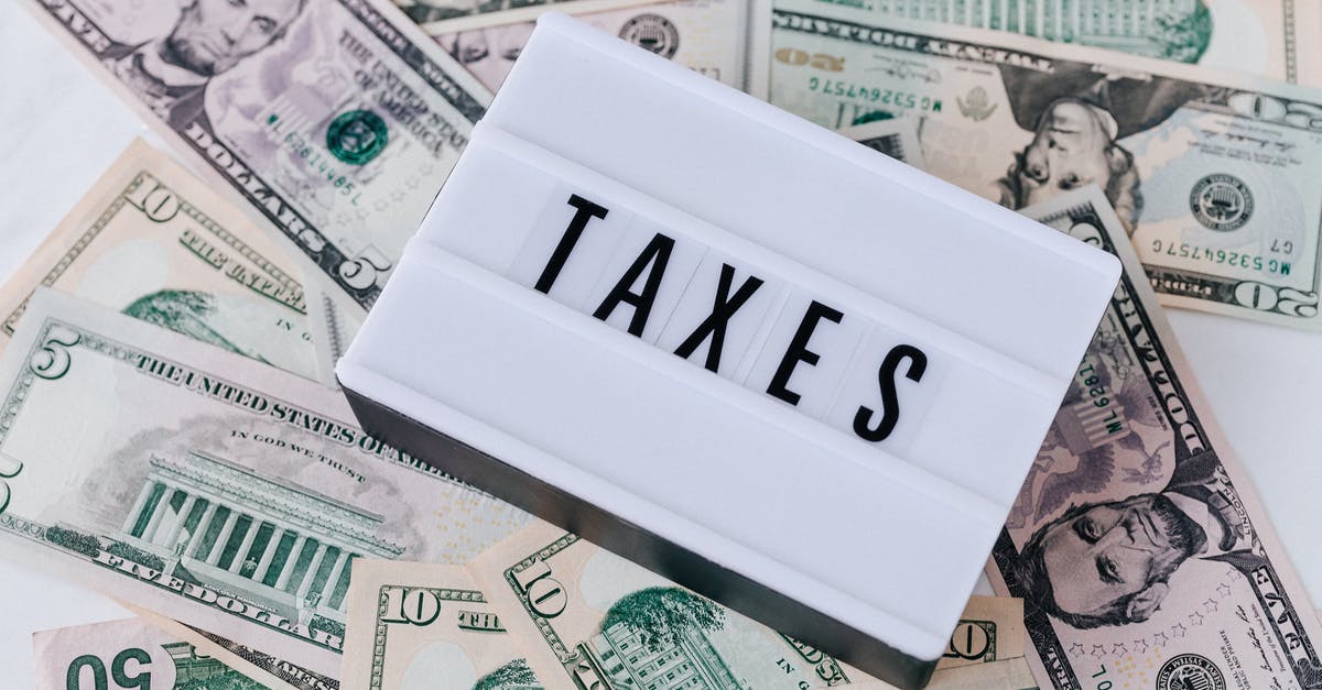 Asking for tourist tax to be left cash in the accommodation - Quote Board on top of Cash Bills Asking for tourist tax to be left cash in the accommodation - Quote Board on top of Cash Bills