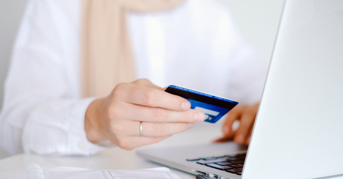 Asking for VAT refund on online purchases in Europe [closed] - Person in White Long Sleeve Shirt Holding Credit Card