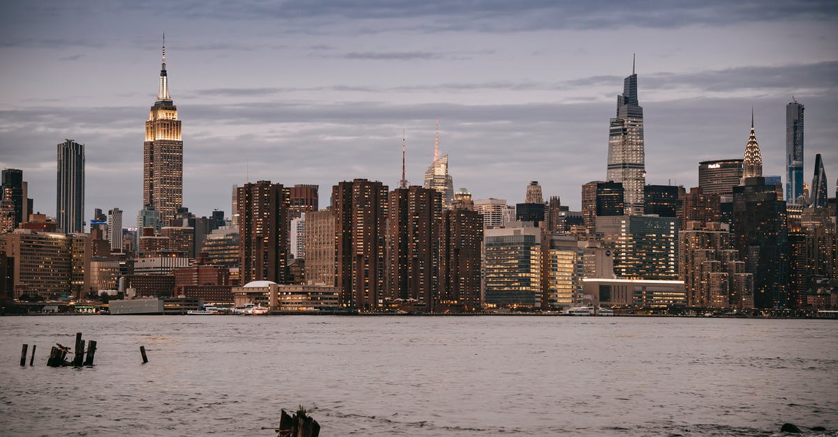 At what non-preclearance airports are there US DHS officers? - Modern architecture with towers and skyscrapers with luminous lights in windows on river bank in NYC At what non-preclearance airports are there US DHS officers? - Modern architecture with towers and skyscrapers with luminous lights in windows on river bank in NYC