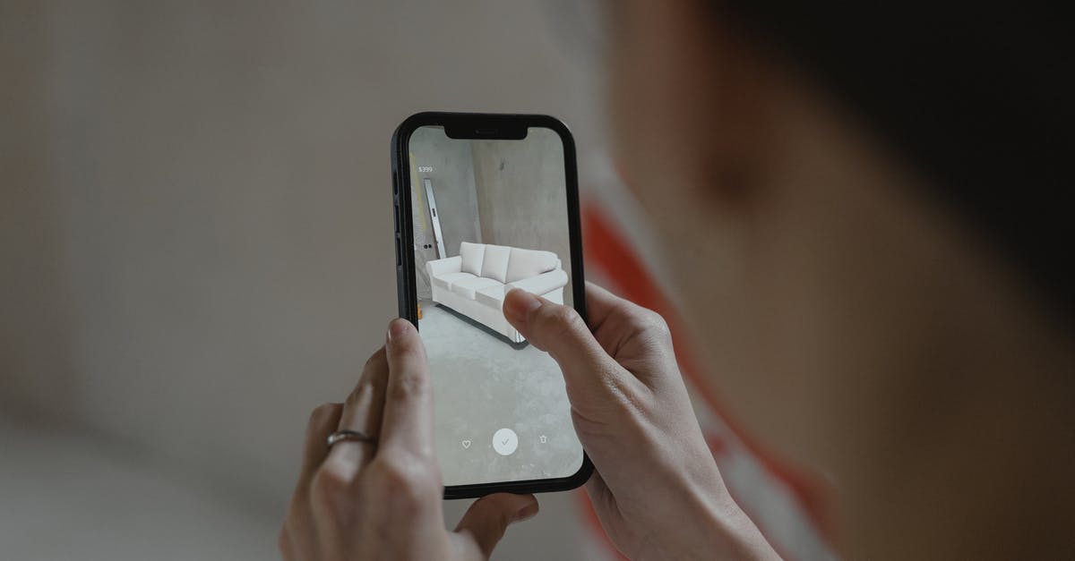 Augmented reality app to identify what's around you - Person Holding Black Iphone Augmented reality app to identify what's around you - Person Holding Black Iphone