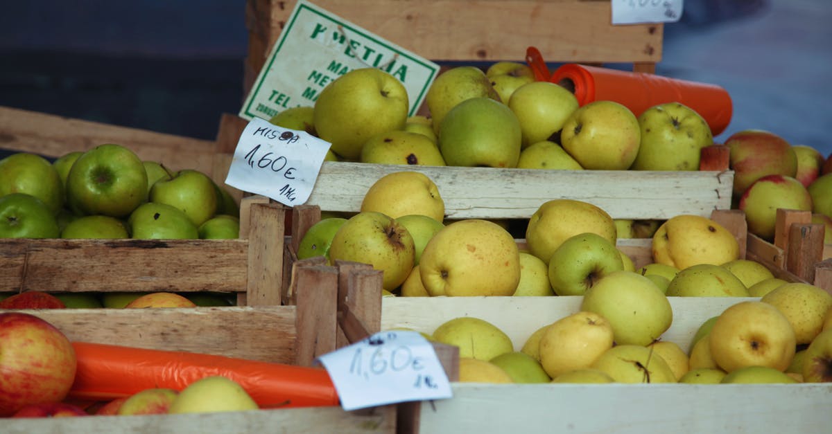 Australia: How to know price of goods in groceries - Ripe apples in boxes on market Australia: How to know price of goods in groceries - Ripe apples in boxes on market