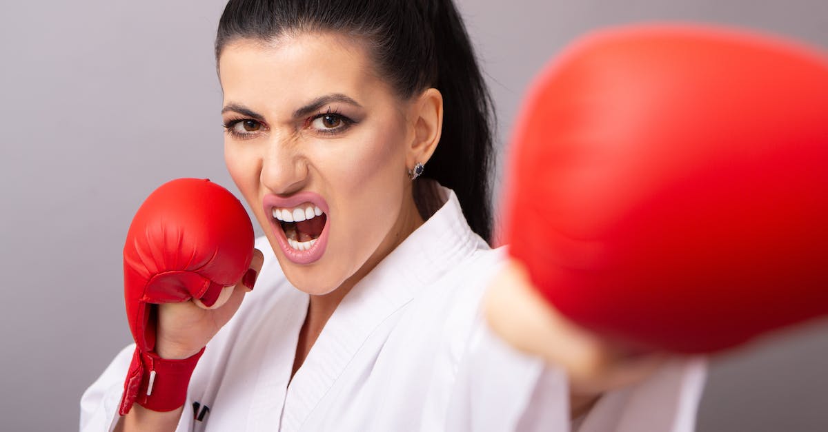 Australian to Japanese power converter? - Karateka in red gloves performing punch on gray background Australian to Japanese power converter? - Karateka in red gloves performing punch on gray background