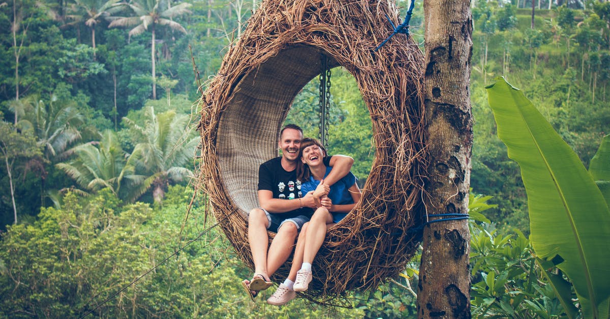 Australian travelling to EU before the date of my visa - Man and Woman Sitting on Hanging Chair by a Tree Australian travelling to EU before the date of my visa - Man and Woman Sitting on Hanging Chair by a Tree