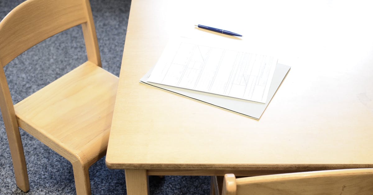 B1/B2 Visa - Additional information requested - From above of application form on paper sheets near pen on wooden desk in daylight B1/B2 Visa - Additional information requested - From above of application form on paper sheets near pen on wooden desk in daylight