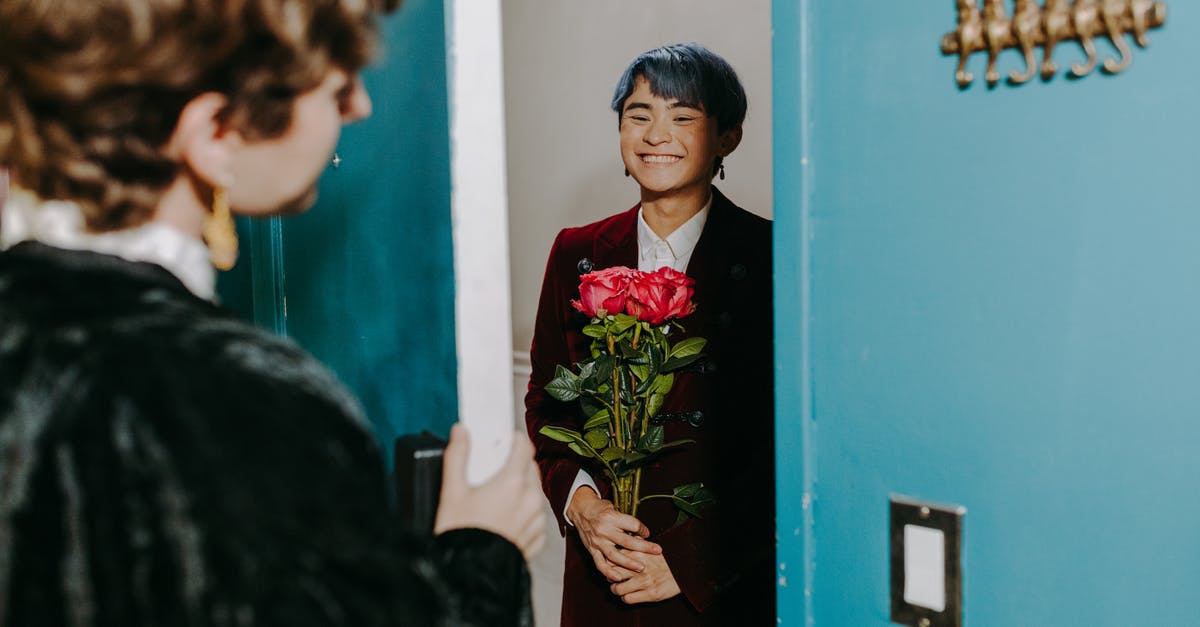 B2 Visa stuck in administrative processing for over 120 days now - A Man at the Doorway Holding Flowers