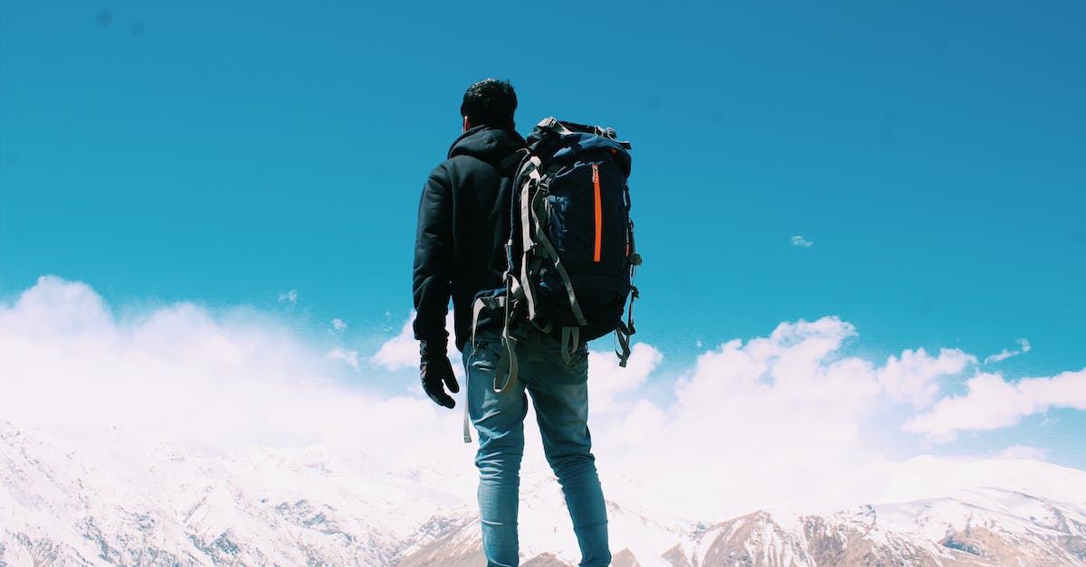 Backpacking - travelling with 'smart' clothes - Photo of Man Standing On Top Of Mountain Backpacking - travelling with 'smart' clothes - Photo of Man Standing On Top Of Mountain