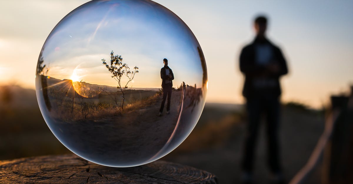 Backup photos to the cloud while traveling? - Forced Perspective Selective Focus Photography of Man Inside the Ball Backup photos to the cloud while traveling? - Forced Perspective Selective Focus Photography of Man Inside the Ball