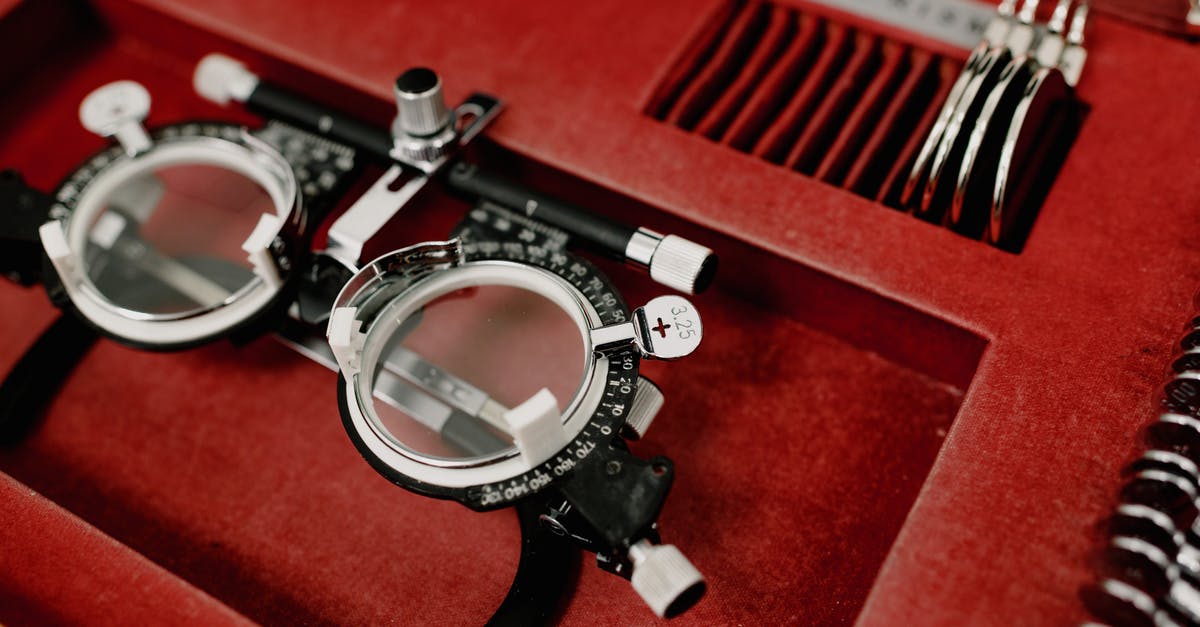 Baggage and check-ins on different airlines - Opened box with optical lenses and rim Baggage and check-ins on different airlines - Opened box with optical lenses and rim