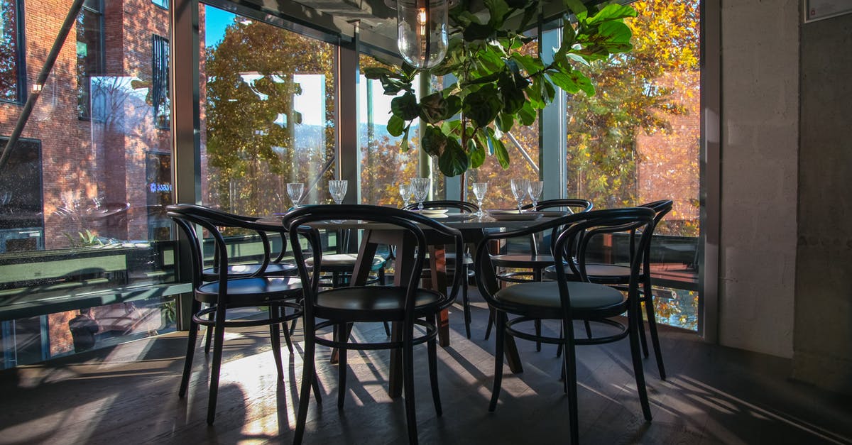 Baltimore - Which areas are the safest? [closed] - Black  Chairs and Table Inside Dining Area With Glass Window