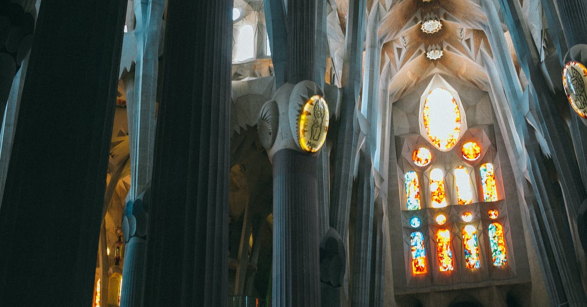 Bangladeshi national with Schengen visa stranded in Spain after UK BRP stolen - From below of tall columns and ceiling in Gothic style in Catholic landmark of Spain Sagrada Familia