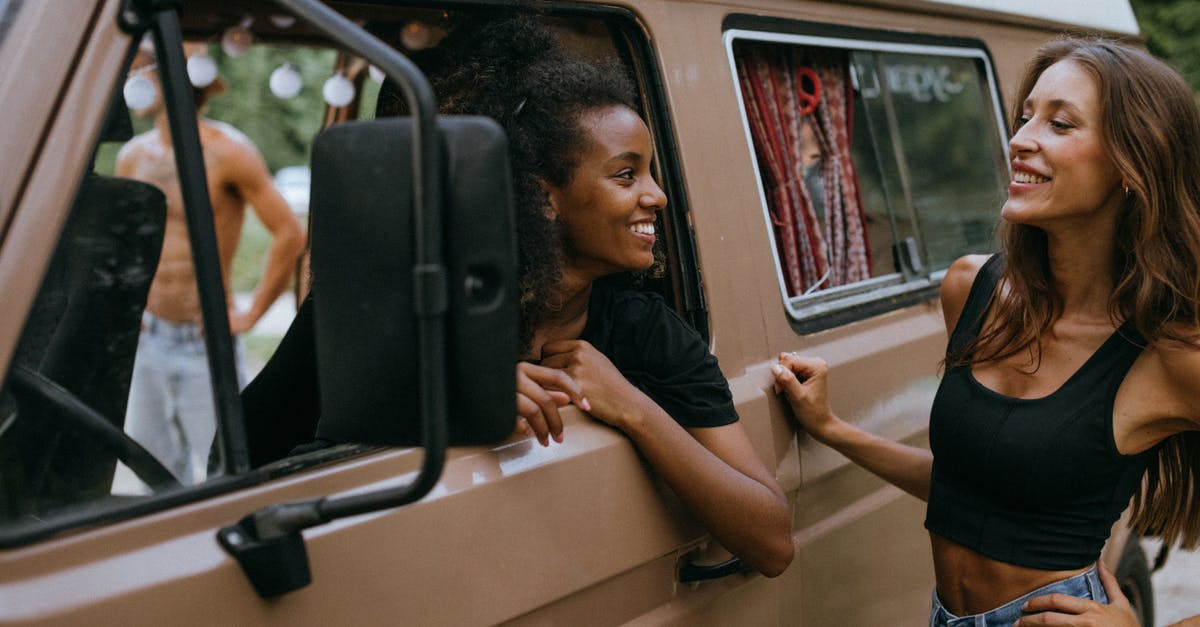 Best transportation method in Sicily - Smiling Women Looking at Each Other Best transportation method in Sicily - Smiling Women Looking at Each Other