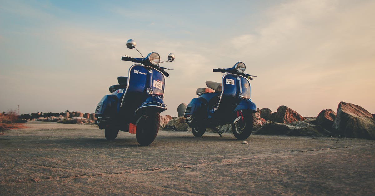 Best travel path from Buenos Aires to Aysen Region, Chile [closed] - Blue mopeds parked on empty road in countryside