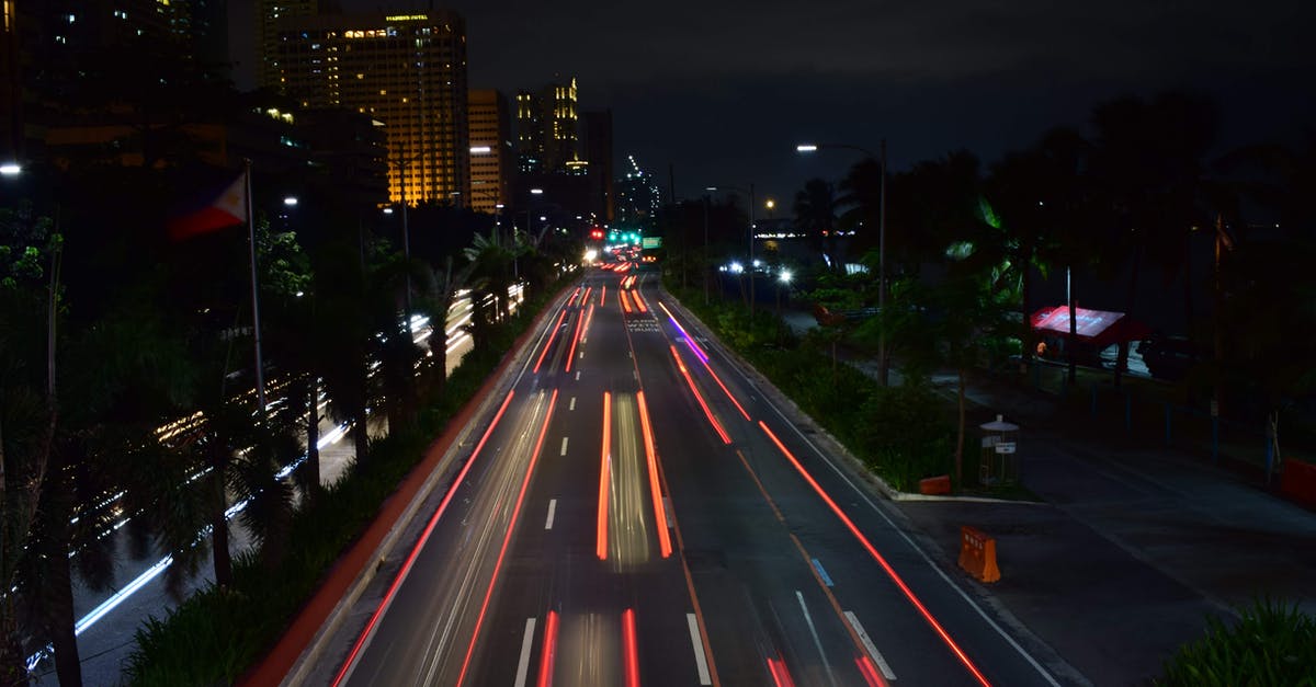 Best way to travel from Palenque to Mexico city by road - Traffic in modern illuminated city at night Best way to travel from Palenque to Mexico city by road - Traffic in modern illuminated city at night