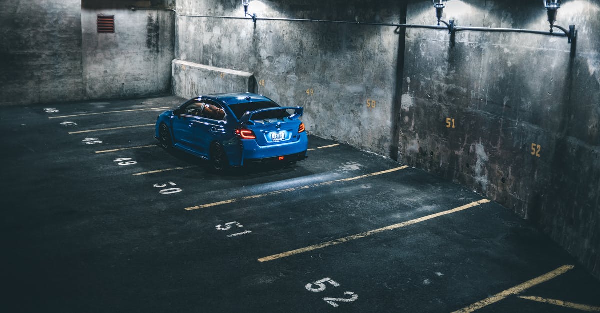 Best way to travel from Palenque to Mexico city by road - Blue car on parking lot Best way to travel from Palenque to Mexico city by road - Blue car on parking lot