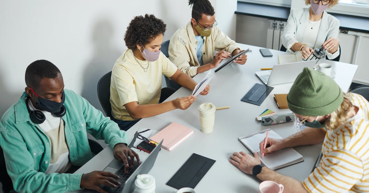 BI/B2 Visa status covid-19 - Man in White Button Up Shirt Holding Pen Writing on White Paper BI/B2 Visa status covid-19 - Man in White Button Up Shirt Holding Pen Writing on White Paper