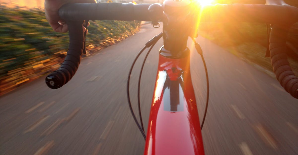 Bicycling routes in Śląskie/Małopolskie - Person Riding on Red Road Bike during Sunset Bicycling routes in Śląskie/Małopolskie - Person Riding on Red Road Bike during Sunset