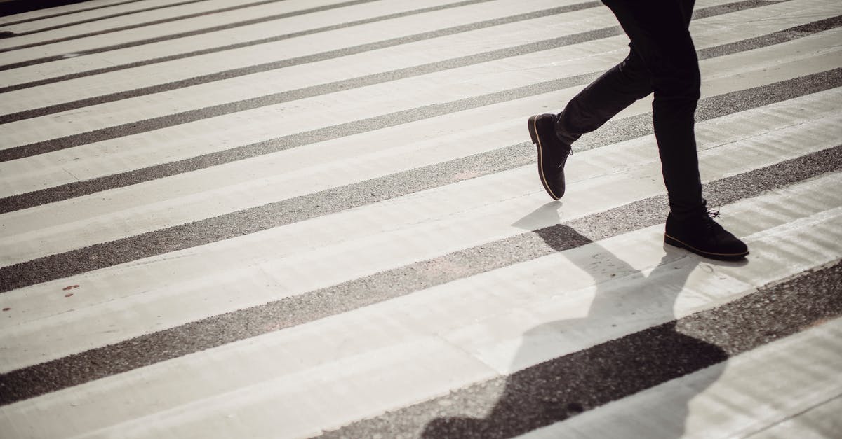 Big Bend border crossing -- safe for campers? - Crop faceless person in elegant black trousers and shoes walking on crosswalk in daytime Big Bend border crossing -- safe for campers? - Crop faceless person in elegant black trousers and shoes walking on crosswalk in daytime