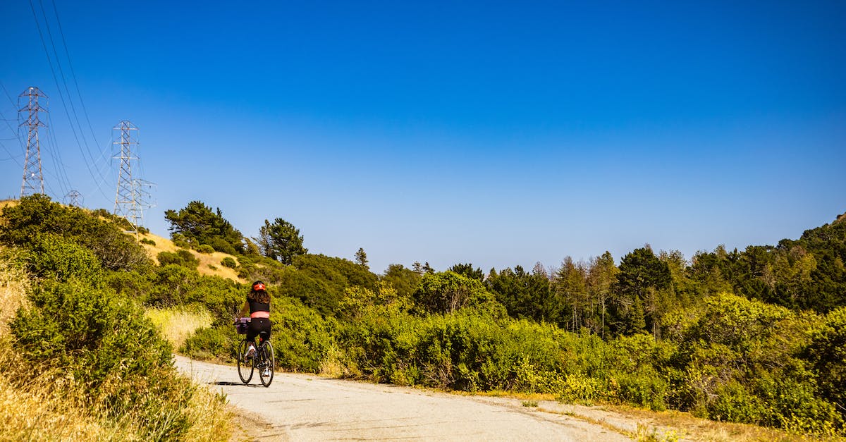 Biking in Arizona: Homebase in Phoenix or Scottsdale? - Man in Black Shirt Riding Bicycle on Road Biking in Arizona: Homebase in Phoenix or Scottsdale? - Man in Black Shirt Riding Bicycle on Road