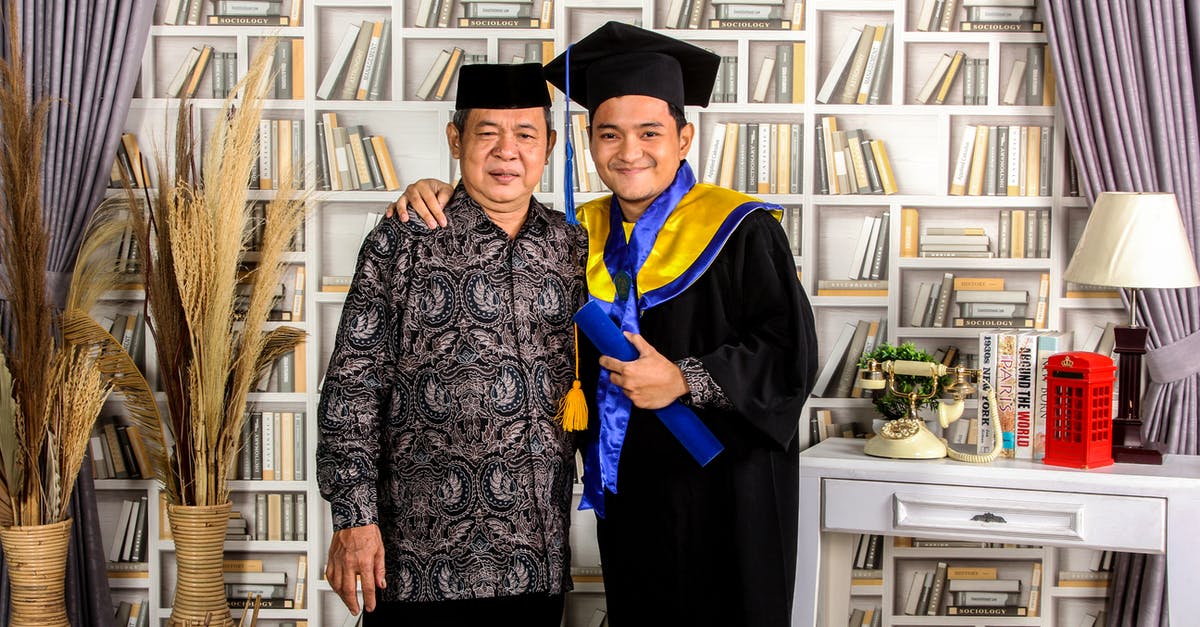 Birth Certificate is larger than an 8.5 x 11 - how to photocopy? - Woman in Black Academic Dress Standing Beside White Wooden Shelf
