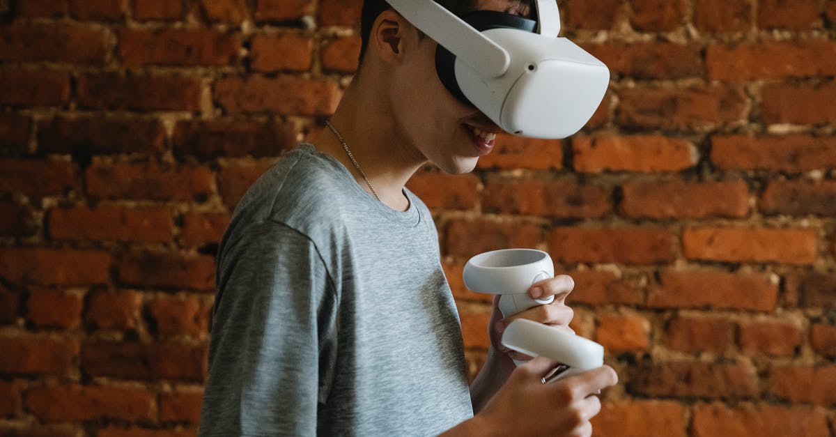 Bluetooth Headset - Do I have anything to worry about if I don't use it during the flight? - Male in casual wear enjoying virtual reality Bluetooth Headset - Do I have anything to worry about if I don't use it during the flight? - Male in casual wear enjoying virtual reality