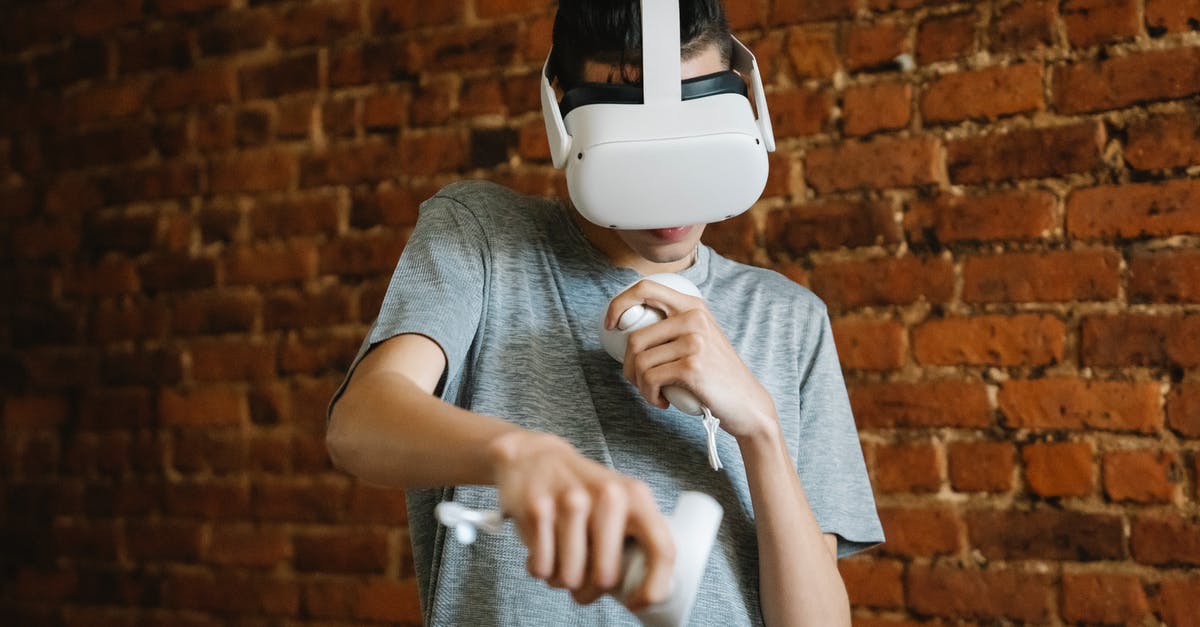 Bluetooth Headset - Do I have anything to worry about if I don't use it during the flight? - Young male teenager in casual clothes using VR headset and controllers while playing game near brick wall Bluetooth Headset - Do I have anything to worry about if I don't use it during the flight? - Young male teenager in casual clothes using VR headset and controllers while playing game near brick wall