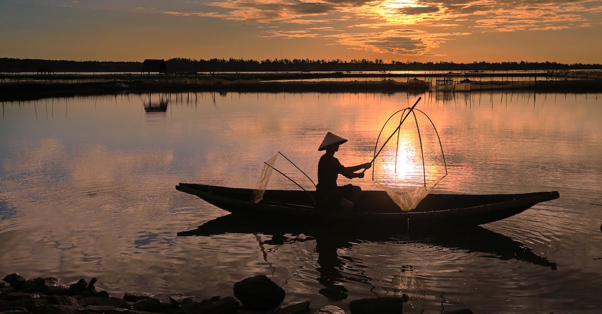 Boat tour on lake Titicaca? - Man Riding on Boat on Lake during Sunset Boat tour on lake Titicaca? - Man Riding on Boat on Lake during Sunset
