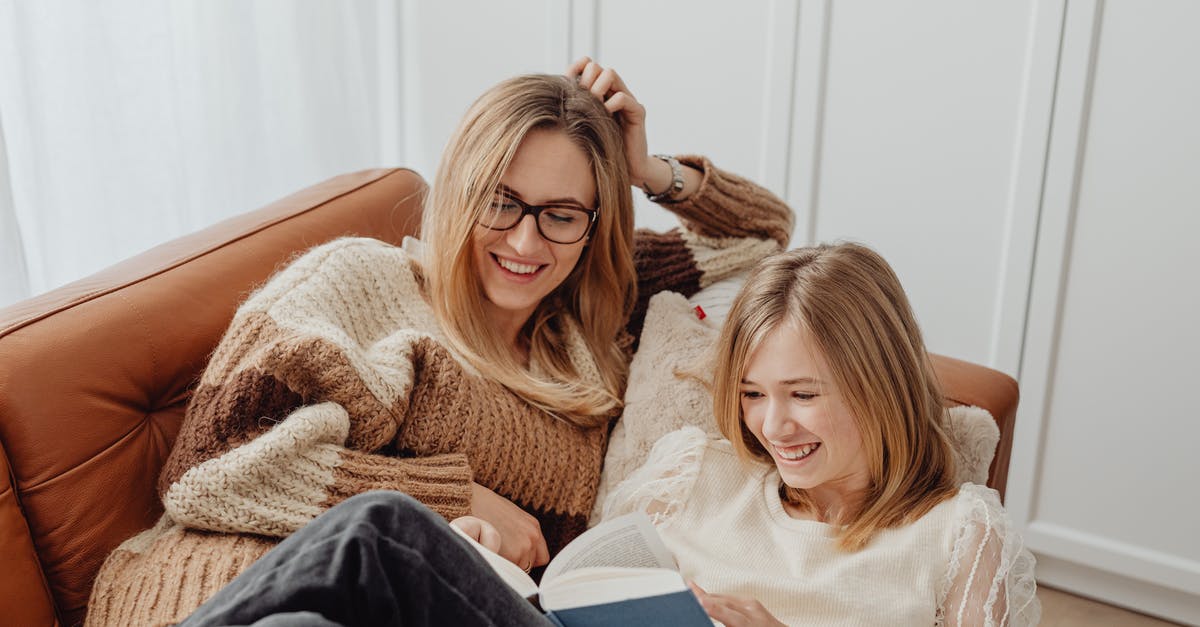 Book ahead in Bali? - Woman in White Sweater Sitting Beside Girl in White Sweater Book ahead in Bali? - Woman in White Sweater Sitting Beside Girl in White Sweater