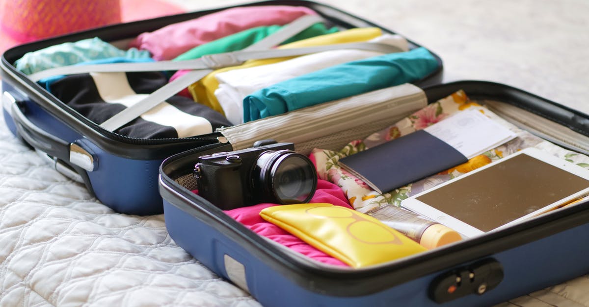 Booked a flight ticket with wrong passport number via a travel agency - Black and Silver Camera on Black Case Booked a flight ticket with wrong passport number via a travel agency - Black and Silver Camera on Black Case