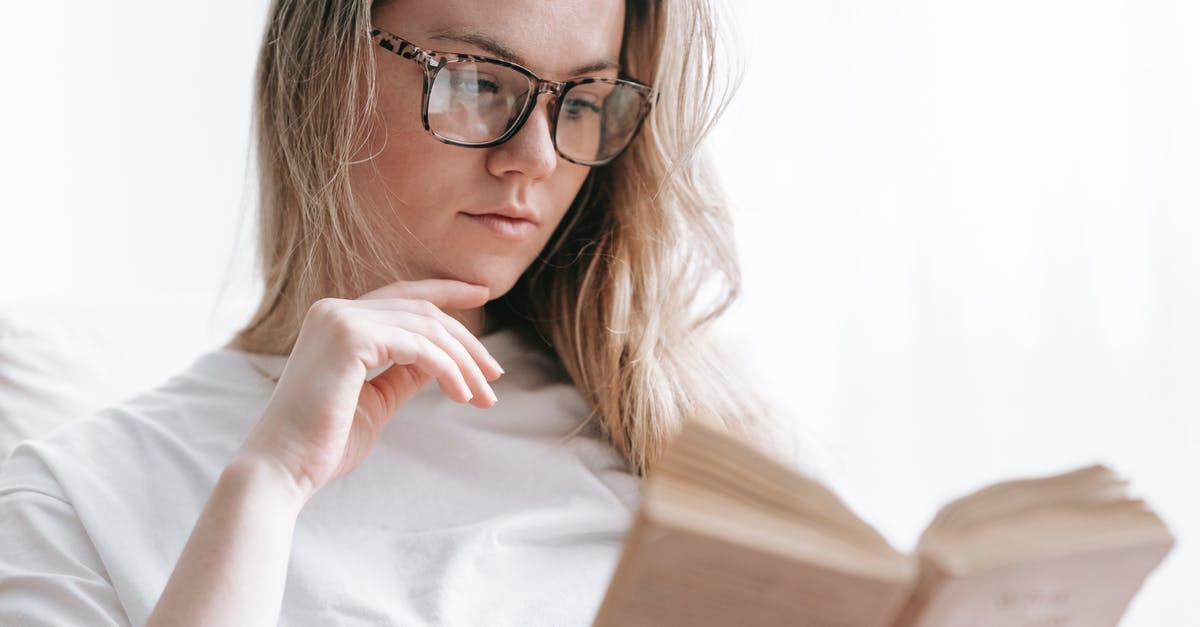 Booking 2 ways ticket, not onboard 1 way, consider canceling both? [duplicate] - Low angle of crop concentrated female in eyeglasses touching chin while reading novel at free time
