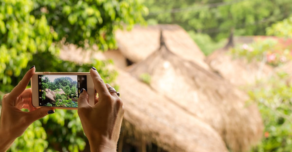 Booking a round trip to Thailand - Person Taking A Picture From A Smartphone Booking a round trip to Thailand - Person Taking A Picture From A Smartphone