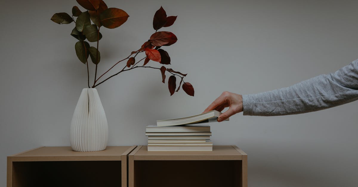 Booking with Czech Airlines but getting on SmartWings flight, any consequences? - Photo of a Person's Hand Getting a Book Beside a Vase Booking with Czech Airlines but getting on SmartWings flight, any consequences? - Photo of a Person's Hand Getting a Book Beside a Vase