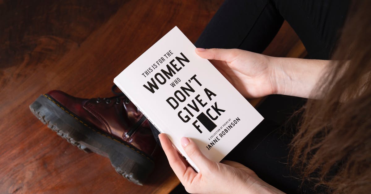Booking with "Pay at the Hotel" option - Woman Holding White Book Booking with "Pay at the Hotel" option - Woman Holding White Book