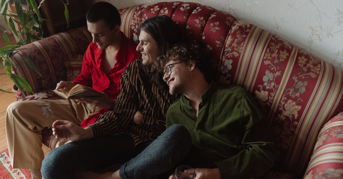 Booking with Third Party Sites - Man in Green Sweater Sitting Beside Woman in Red and White Stripe Shirt Booking with Third Party Sites - Man in Green Sweater Sitting Beside Woman in Red and White Stripe Shirt