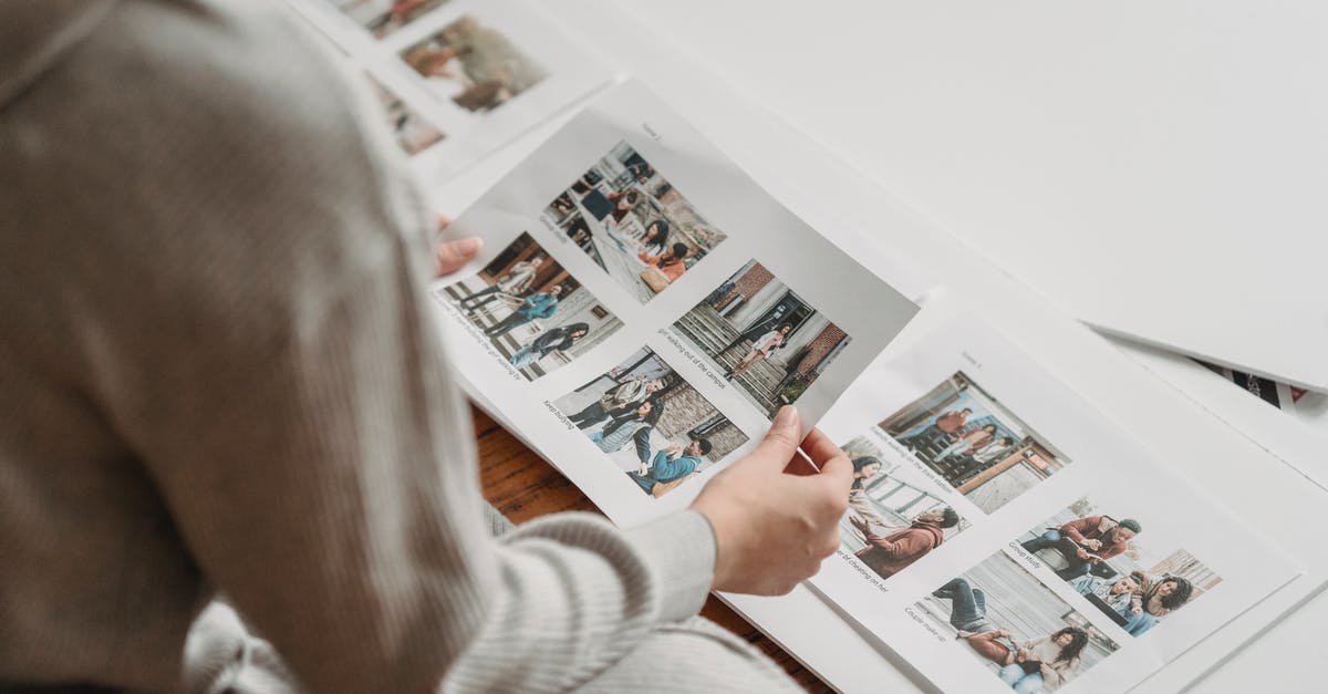 booking.com: do I need to show printed confirmations? - Crop unrecognizable woman looking through printed photos in album booking.com: do I need to show printed confirmations? - Crop unrecognizable woman looking through printed photos in album