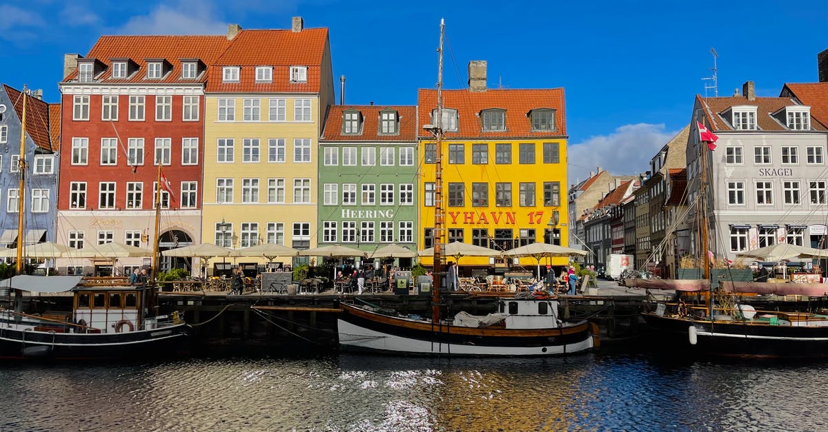 Border Control from Copenhagen (Denmark) to Malmo (Sweden) - Boat on Dock Near Building Border Control from Copenhagen (Denmark) to Malmo (Sweden) - Boat on Dock Near Building