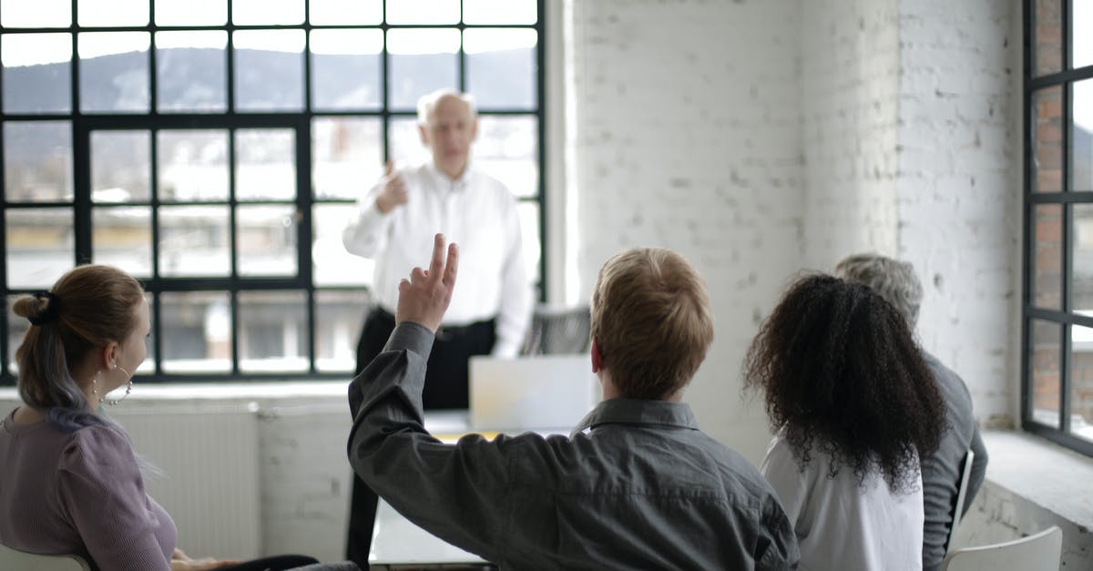 Border control officer asking questions on leaving Canada - People Having a Discussion in a White Room Border control officer asking questions on leaving Canada - People Having a Discussion in a White Room