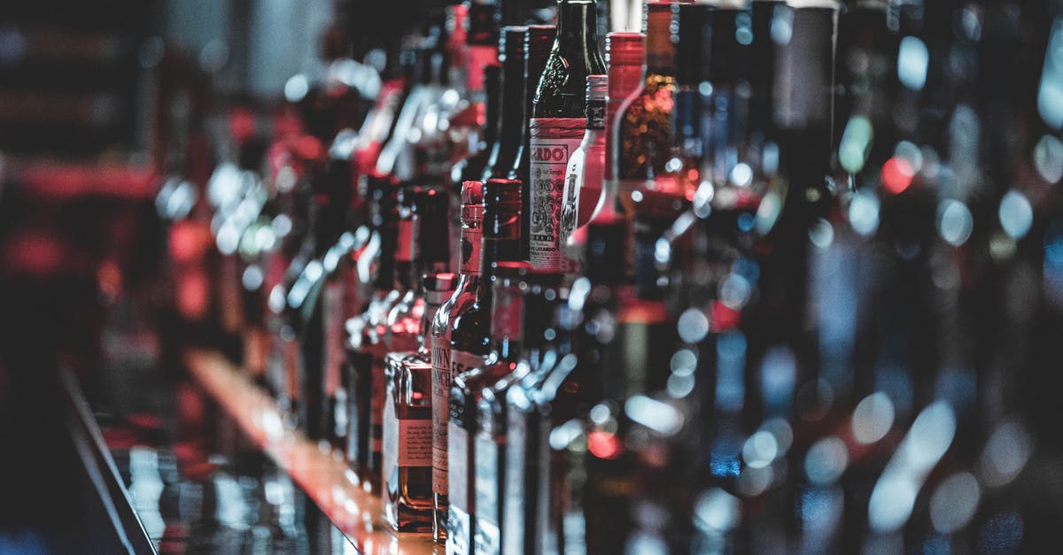 Bringing coumarin-containing liquor into the USA - Selective Focus Photo Of Alcohol Bottles Bringing coumarin-containing liquor into the USA - Selective Focus Photo Of Alcohol Bottles