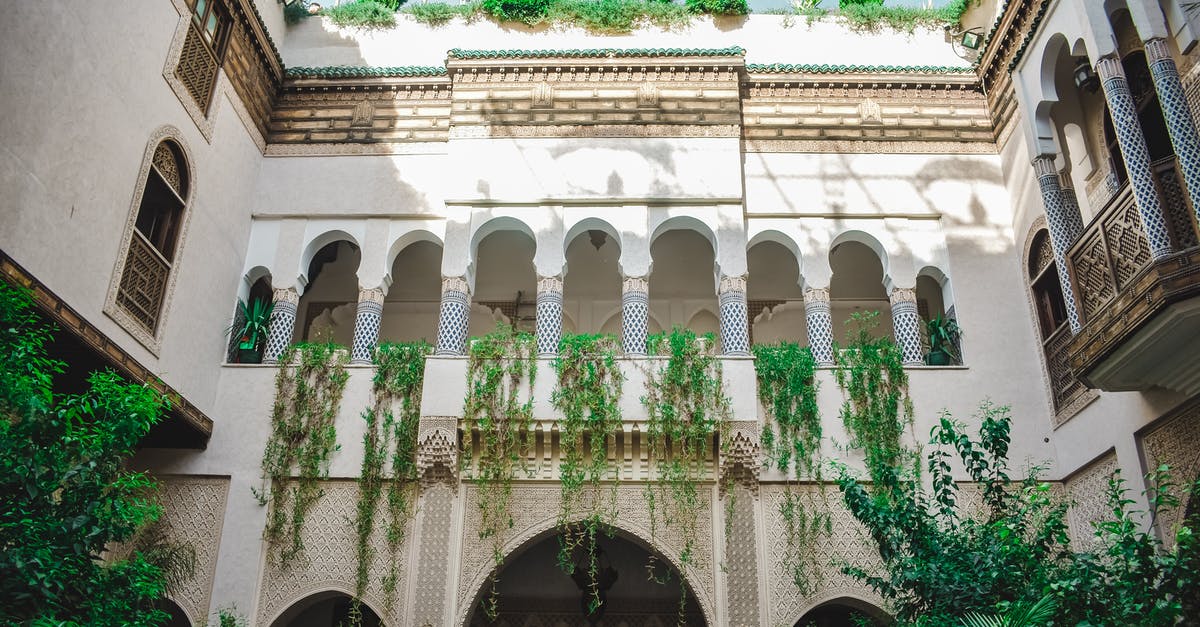 Bringing Dirham to Morocco - Brown Concrete Building Bringing Dirham to Morocco - Brown Concrete Building